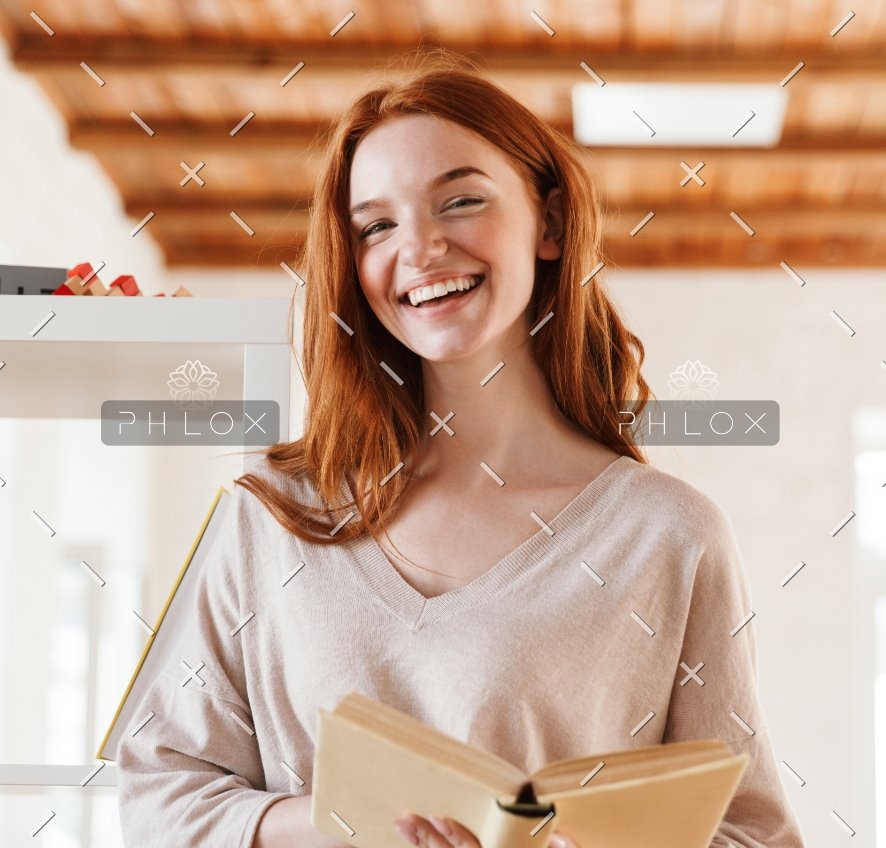 happy-redhead-young-lady-student-reading-book-M5Z7RVC@2x-1